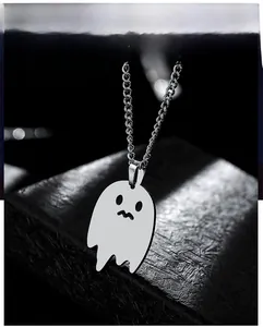 Detailed close-up of a silver ghost pendant necklace with polished finish for Halloween