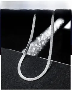 Close-up of sleek silver flat snake bone chain with high-quality polished metal texture