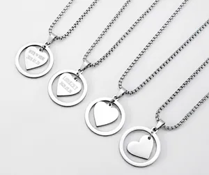 Detailed close-up of custom engraved heart pendant necklaces with box chain in silver