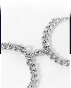 Close-up of silver stainless steel Cuban chain with spherical magnetic buckle clasp