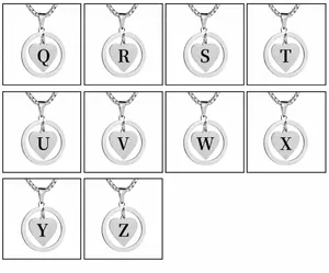 Macro view of heart pendant necklaces showing engraved letters Q to Z in steel finish