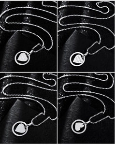 Detail of round ring and heart pendant necklace with custom date and name engraving