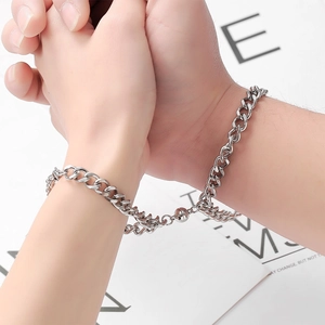 Matching pair of stainless steel Cuban link magnetic bracelets for couples in silver