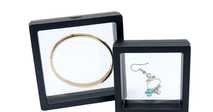 Detail view of 3D floating display frames with PE film showcasing jewelry and bracelets