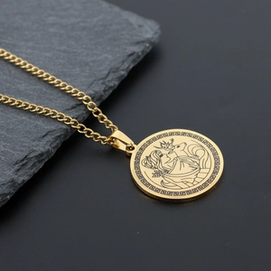 Detailed close-up of Artemis hunting goddess pendant with Greek key pattern border
