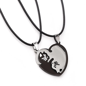Matching cat heart necklaces in black and silver steel for couples and friends