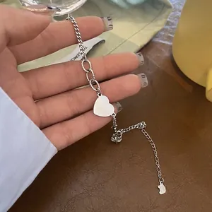 Minimalist silver-toned titanium steel heart charm bracelet with mixed chain textures