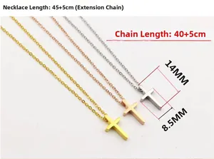 Close-up of mini cross pendants in gold, rose gold, and silver stainless steel