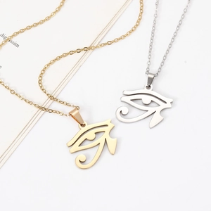 Polished gold and silver Eye of Horus stainless steel necklaces on a cross chain