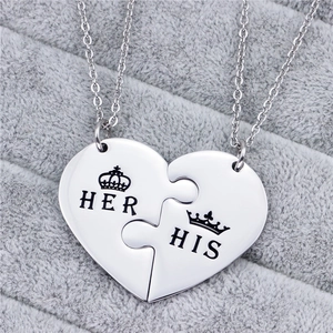 Polished titanium steel His and Her puzzle heart necklaces with crown engraving