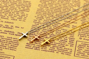 Three-color polished titanium steel mini cross necklaces in gold, silver, and rose gold