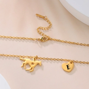 Gold stainless steel necklace with heart pendant and horse charm featuring letter E
