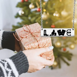 Cowboy Rodeo LOVE necklace in stainless steel on a festive gift box for Christmas
