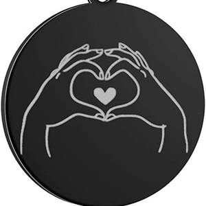 Black stainless steel round pendant with engraved hand heart gesture and small hole