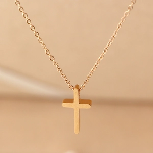 Polished gold mini cross pendant necklace with fine chain for women minimalist style