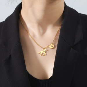 Polished gold stainless steel necklace with a galloping horse and letter A heart pendant