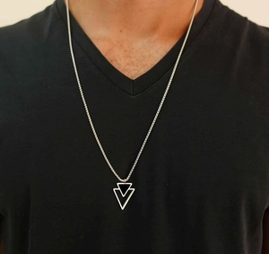 Detail of men's silver steel necklace with nested inverted triangle pendant on model