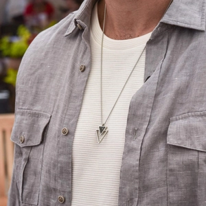 Men's double triangle stainless steel necklace with black marble pendant on a snake chain