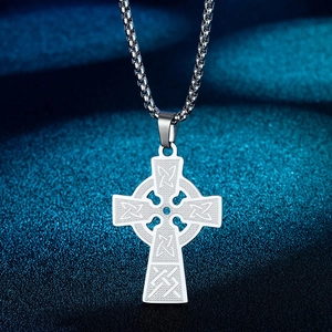Silver Celtic cross pendant necklace with intricate knot engraving on starry background