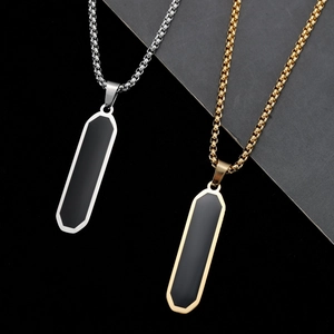 Minimalist geometric bar pendant necklace in silver and gold with black oil drip inlay