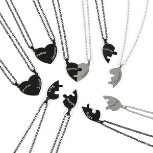 Family stainless steel puzzle heart necklaces set with engraved titles in black and silver