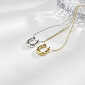 Minimalist U-shaped pendant necklaces in polished gold and silver finishes for women