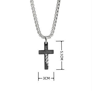 Detail view of black cross pendant with Spanish scripture and size markings