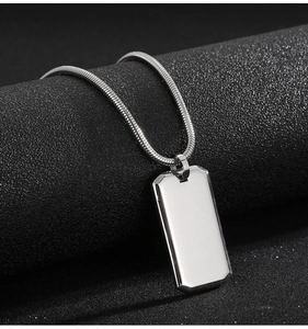 Minimalist silver mirror-polished stainless steel dog tag necklace with a sleek snake chain