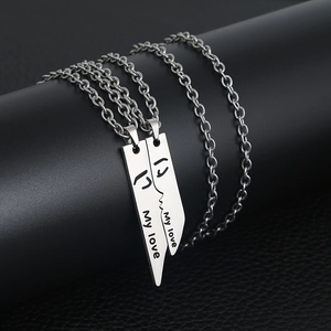 Polished stainless steel couple necklaces with 'My love' engraving and portrait contours