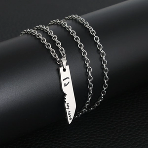 Couples stainless steel puzzle necklace with My Love engraving on black display