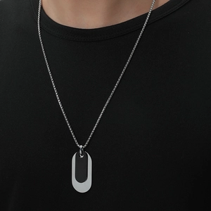 Men's necklace with dual oval steel pendants in black and silver on a box chain