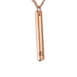 Rose gold mindfulness breathing whistle necklace with minimalist cylinder pendant