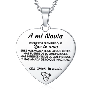 Polished heart pendant with Spanish text A mi Novia and three hearts on cross chain
