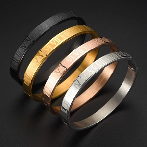 Macro shot of four colors of stainless steel bracelets with engraved Roman numerals