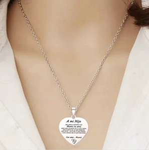 Inspirational heart pendant necklace in silver stainless steel worn by a model