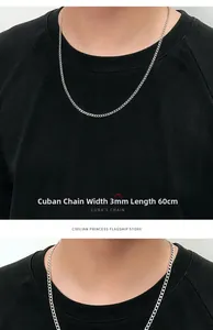 Détail d'une chaîne à maillons cubains en acier argenté de 3 mm de large et 60 cm de long