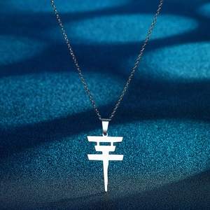 Silver stainless steel necklace with Tokyo Hotel logo pendant on blue background