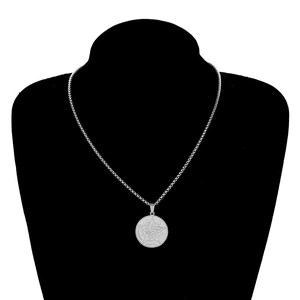Men's stainless steel pentagram coin necklace with occult symbols on a black display