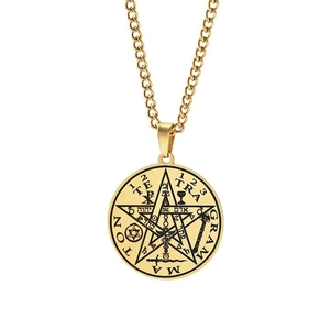 Macro shot of gold stainless steel seal of Solomon pendant with detailed occult engravings