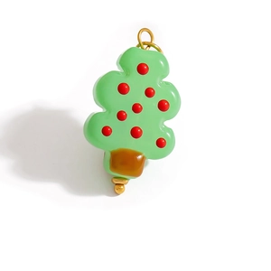 Christmas tree shaped pendant in green enamel with festive red dots and gold metal ring