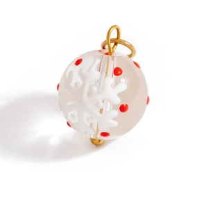 Christmas reindeer snow globe pendant with gold accents and snowflakes on white background