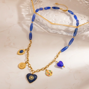 Blue resin beaded heart necklace with gold luck pendant and stainless steel chain