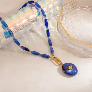 Elegant stainless steel blue resin beaded necklace with golden sun pendant for women