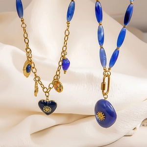 Golden stainless steel necklaces with blue heart charms and sun pattern pendants