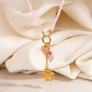 Roze kralenketting met hart engel hanger en gouden bloemen in Y-stijl ontwerp
