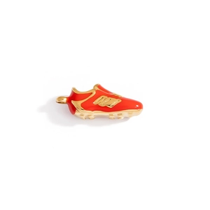 Detailed close-up of a red enamel soccer shoe pendant with gold plated metallic cleats