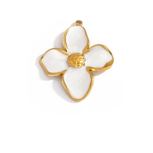 Detailed close-up of a gold-plated white enamel flower pendant with textured core
