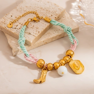 Bohemian braided bracelet with gold beads, cowboy boot, hat, and opal pendants