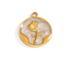 Detailed macro view of a vintage golden rose relief pendant with pearlescent base