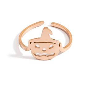 Detail view of rose gold adjustable pumpkin and witch hat ring with hollow carved pattern